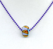Load image into Gallery viewer, Blue core with orange and purple encased in clear glass bead on ball chain
