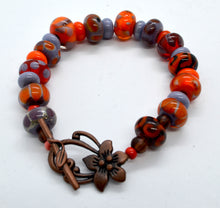 Load image into Gallery viewer, Vibrancy in orange and purple -Lampwork Glass Bead Bracelet