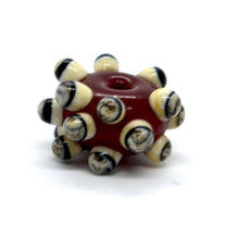 Load image into Gallery viewer, Red glass bead with Raised Dots in Ivory and Black
