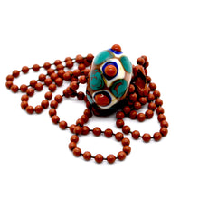 Load image into Gallery viewer, Lampwork glass bead on ball chain in terracotta, white, teal, blue.