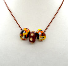 Load image into Gallery viewer, 3 Lampwork glass beads on ball chain in black, yellow, red, white
