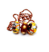 Load image into Gallery viewer, 3 Lampwork glass beads on ball chain in black, yellow, red, white
