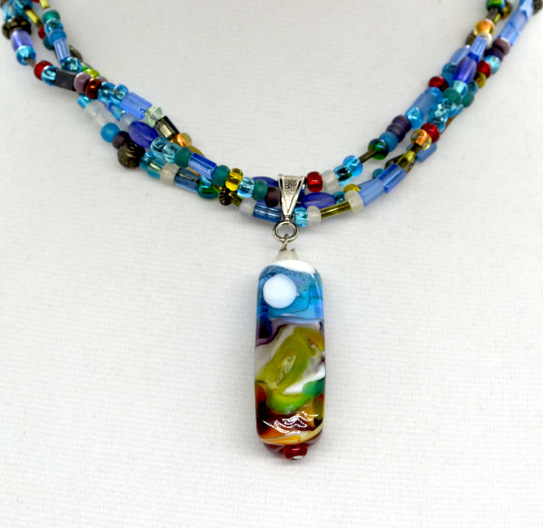 Landscape lampwork bead with multicoloured triple strand necklace