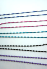 Load image into Gallery viewer, Lampwork glass bead on ball chain in black, white, purple and transparent salmon.
