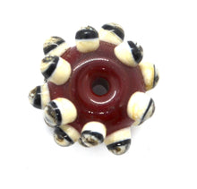 Load image into Gallery viewer, Red glass bead with Raised Dots in Ivory and Black
